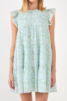 This beautiful dress is perfect for any special occasion. With a floral print and delicate embroidery, this dress is sure to turn heads. The back spaghetti tie allows you to adjust the fit, while the side pockets provide a touch of functionality. Whether you're attending a wedding or a birthday party, this dress is sure to make you feel like the belle of the ball. Floral with embroidery Back spaghetti tie Side pockets Lining Hand wash cold Do not bleach Do not tumble dry Iron low Shell: 100% Cot Print With Embroidery, Delicate Embroidery, Neck Ruffle, Ruffle Sleeves, Babydoll Dress, Beautiful Dress, A Wedding, Blue Dresses, Beautiful Dresses