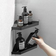 two shelves holding soap, lotion and hand sanitizers