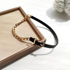 ✦ Elevate your style with our Asymmetric Cool Leather Half Chain Choker Necklace. This striking piece features a unique combination of half bold curb chain and half belt leather chain, creating a cool and stylish look. Perfect for any occasion, from a fancy dinner to a casual day out. Available in brown and black for a touch of cowboy charm. ----------- DETAILS ------------ Size (Length*Width):41cm include chain Width 0.9cm- Color: Black/ Brown- Materials: Alloy, Leather- SKU: HN940 Trendy Black Chain Belt With Chain Strap, Edgy Chain Link Belt, Edgy Chain Link Belt With Chain Strap, Chic Black Chain Link Belt, Chic Black Adjustable Chain Belt, Trendy Adjustable Chain Necklace For Formal Events, Adjustable Black Chain Belt, Adjustable Black Chain Link Belt, Adjustable Black Chain Belt With Chain Strap