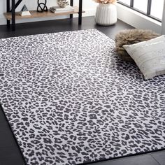 a leopard print rug in a living room