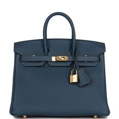 This Birkin is in Bleu De Prusse Togo leather with gold hardware, has tonal stitching, front flap, two straps with center toggle closure, clochette with lock and two keys, and double rolled handles.The interior is lined with Bleu De Prusse chevre and has a zip pocket with an Hermes engraved zipper pull and an open pocket on the opposite side.Collection: BOrigin: FranceCondition: New and never  (plastic on hardware) Accompanied by: Hermes box, Hermes dustbag, clochette, lock, two keys, clochette dustbag, carebook and feltMeasurements: 10" width x 7.5" height x 4.75" depth; 2.75" handle drop Birkin Bag Hermes, Anarchy Symbol, Hermes Birkin 25, Hermes Box, Togo Leather, Luxury Purses, Birkin 25, Hermes Bags, Wallet Accessories