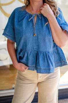 Turn heads with our Denim Dreams Ruffled Tie Front Top! The playful ruffled hem and unique tie front detail add a touch of whimsy to the classic denim design. Perfect for casual outings or dressed up for a night out. Live out your denim dreams in style! 90% Polyester 10% Cotton Model 5'7" Size 5/27 Wearing Medium Denim Tie, Casual Blouse Shirts, Unique Ties, Crop Blazer, Tie Front Top, Denim Shoes, Front Tie Top, Denim Design, Short Rompers