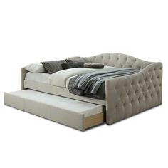 a bed with a pull out trundle sitting on top of it's side