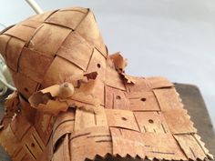 a piece of wood that has been made into a basket with holes in the middle