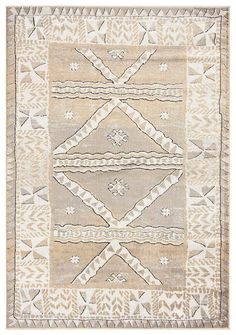 a beige and white rug with an intricate design on the front, in different colors