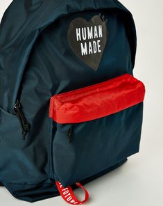 The Human Made Backpack delivers a sleek, lightweight design with a standout PVC heart logo and practical functionality. Featuring a spacious main zip compartment, an inner pocket, and adjustable padded shoulder straps, this bag combines street-ready style with everyday utility. PVC heart logo on the front. Patch label on the back. Interior woven patch label. Main zip compartment with inner pocket. Front compartment with a branded webbing loop under. Adjustable padded shoulder straps. 100% Nylon Icon X, Human Made, Rick Owens Drkshdw, Sweatpants Shorts, Heart Logo, Boot Accessories, Sunglasses Shop, Denim Pant, Good Brands