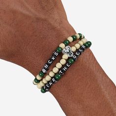 A whole new way to rep the team in style is here. Step up your fan fashion sense with this Milwaukee Bucks 3 Pack Beaded Friendship Bracelet. These matching friendship bracelets have an all-over team-colored design and team logo displays, which makes them the perfect way to show your support for the Milwaukee Bucks on gamedays and every day in between. Every bead bracelet design is the perfect addition to your outfit, whether you’re heading to the game, watching at home, or just hanging out with Casual Adjustable Wristband For Fan Merchandise, Casual Game Day Wristband With Letter Beads, Casual Team-colored Beaded Bracelets For Sports Events, Casual Beaded Bracelets In Team Colors For Sports Events, Matching Friendship Bracelets, Cool Friendship Bracelets, Friendship Bracelets With Beads, Fan Fashion, Beads Bracelet Design