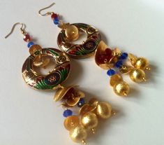 "You are looking at a beautiful pair of hand enameled Egyptian chandelier earrings. . **Based on gold plated brass. **very lightweight these are 1.25 inch wide and 4 inch long. **Get all the beautiful colors of the season with these colorful dangle earrings. **These are Hook earrings Get holiday ready! Thank you for your support. We are proud to announce that \"TANEESI JEWELRY\" has been featured on the cover of \"BEAD STYLE MAGAZINE\" ,NOV 2014 Issue. Please read a full write up on my work on P Hand Painted Festive Earrings For Festivals, Bohemian Meenakari Danglers For Celebration, Traditional Hand Painted Earrings For Festivals, Fusion Style Multicolor Danglers As Gift, Fusion Style Multicolor Danglers For Gift, Multicolor Fusion Danglers For Gift, Traditional Hand Painted Round Beads Jewelry, Traditional Hand Painted Dangle Earrings, Traditional Hand Painted Dangle Jewelry