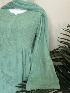 "Chikankari kurta on fine georgette with matching chiffon Dupatta. Matching liner included.  \"Embroidery designs may slightly vary\" Kurti Length-52 inches" Green Georgette Blouse Piece With Intricate Embroidery, Green Kurta With Chikankari Embroidery In Georgette, Anarkali Pista Green Blouse With Chikankari Embroidery, Pista Green Embroidered Georgette Kurta, Embroidered Pista Green Georgette Kurta, Green Georgette Kurta With Intricate Embroidery, Traditional Chiffon Kurta With Dabka Work, Long Sleeve Georgette Blouse Piece With Intricate Embroidery, Long Sleeve Blouse Piece With Intricate Embroidery