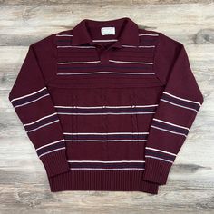 "Check out this gorgeous 60s/70s vintage collared cable knit acrylic sweater here by Anderson Little.  Total Madmen vibes.  Maroon acrylic sweater with blue and white stripes. Excellent condition for its age. No stains, holes or major damage.  Fresh, clean and ready to wear. Tagged size Medium (fits more like a modern men's small) Actual measurements are: 18\" Pit to Pit 24\" Tag to Hem 32\" Tag to Cuff 16\" Shoulder to Shoulder 24\" Sleeve Any questions, please feel free to reach out. Refund/Exchange Policy Vintage = old. Many of our items are 20-40+ years old. Our mission is to rescue these amazing pieces from being discarded and forgotten about but sadly many items can can suffer from wear and tear over the years.  We will do our best to photograph and point out any significant damages, Retro Long Sleeve Polo Sweater, Red Vintage Knitted Sweater, Retro Long Sleeve Argyle Sweater, Vintage Red Crew Neck Sweater, Retro Multicolor V-neck Sweater, Acrylic Sweater, Ivy League, 70s Vintage, Mad Men