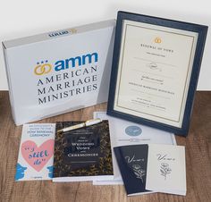 an american marriage certificate and other items on a wooden table next to a framed award