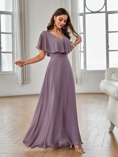 a woman in a long purple dress