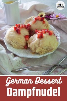 the german dessert dampfuel is served on a plate next to a cup of tea