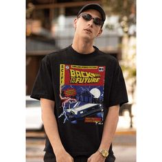 a young man wearing sunglasses and a black t - shirt with back to the future on it