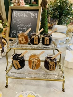 jars of jams are sitting on a table