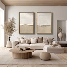 a living room with two paintings on the wall