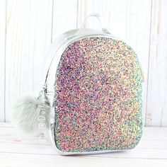 This Is A Brand New With Tags Primark Women's Mini Holographic Rainbow Glitter Backpack. Made From Metallic Silver Vegan Leather And Chunky Metallic Holographic Glitter. The Glitter Gives Off Rich Colors That Change Depending On The Angle. Features A Large Open Interior, Silver-Toned Hardware, And A Large Faux Fur Pom-Pom Zipper Pull. The Combination Of Super Sparkly Glitter And High-Shine Silver Vegan Leather Makes This Bag Captivating! The Adjustable Straps Are The Perfect Size For Both Women School Backpack With Glitter Details, School Glitter Backpack, School Backpack With Glitter, Iridescent Standard Backpack For Everyday Use, Primark Bags, Teal Rings, Glitter Backpack, Snake Skin Handbag, Yellow Purses