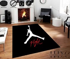 a living room with a rug that has a basketball player on it in front of a fire place