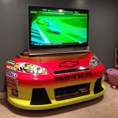 a television that is on top of a race car