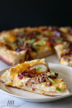 a slice of pizza sitting on top of a white plate