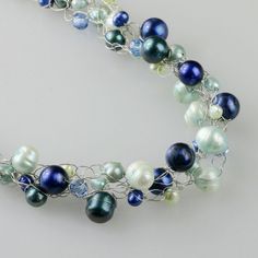 "This crocheted necklace is handmade using fresh water pearls. Perfect gift for any occasion! Free U.S shipping! Anni Designs. Customers who purchased this item said: \"Purchased these for my Bridesmaids. They are made so well, I can't wait to see them on all of them\" \" absolutely beautiful super fast shipping.\" Blue is a universal favorite color of both men and women. Who doesn't love the clear sky and the swaying ocean? It is calm, posed and dignified. The pearls with a subtle shine are tim Handmade Pearl Bridal Necklace As Gift, Handmade Pearl Beaded Necklace For Anniversary, Handmade Blue Pearl Necklace Gift, Handmade Blue Pearl Necklace For Gift, Handmade Delicate Bridal Necklace For Gift, Handmade Blue Bridal Necklace For Gift, Elegant Wire Wrapped Beaded Necklaces For Gifts, Elegant Wire Wrapped Beaded Necklaces As Gift, Elegant Wire Wrapped Beaded Necklace For Gift