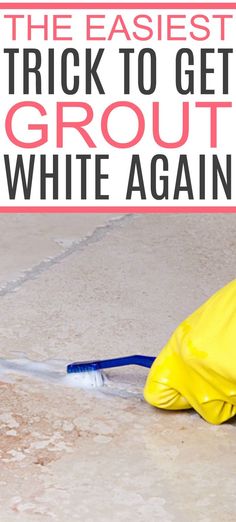 a person in yellow raincoats cleaning the floor with a blue brush