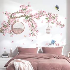 a bed room with a neatly made bed and pink comforter