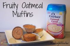 some muffins are sitting on a plate next to a bottle of nut butter