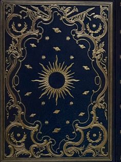 an old book with gold trimmings and a sun in the middle on a blue background