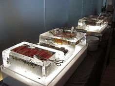 the buffet table is set up with many different foods