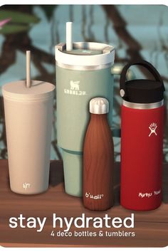 three different types of water bottles and tumblers on a table with the words stay hydrated