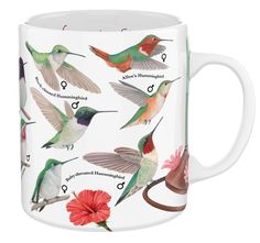 a white coffee mug with hummingbirds on it