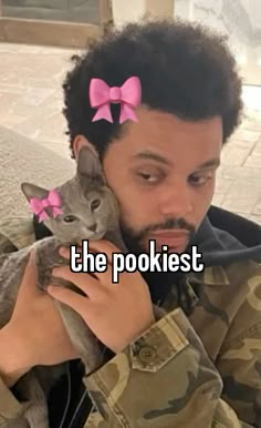 a man holding a cat in his arms with the caption, the pokiest