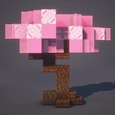 a pink tree with lots of blocks on the top and bottom branches, in front of a gray background