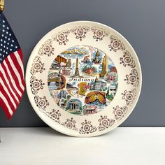 a white plate with an american flag on it next to a blue and white wall