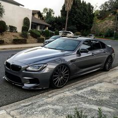 a silver car parked on the side of a road