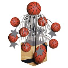 a bunch of basketballs sitting on top of a wooden block with silver stars around them