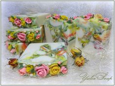 soap bars with flowers on them sitting next to each other