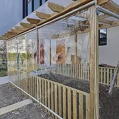 a wooden structure with plants growing in it