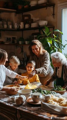 a group of people standing around a table filled with food