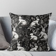 black and white rabbits in the woods throw pillow