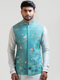 This Sea Blue Madhubani Nehru Jacket will instantly give an elegant look. This Sea Blue Nehru Jacket features in bam silk fabric with kantha stitch detail, aari-khich work, madhubani motif embroidery, french knots, invisible front button placket, and a mandarin collar. An ideal outfit for traditional occasions, and special events.

Size Chart For Men





	
	
					Men's Size Chart
		

		
		
						
				Size Chart For Men
				Custom Size Measurement Guide
			
			
				
				
				Custom Size Measurem Baby Dress Wedding, Asymmetric Kurta, Maternity Photography Poses Couple, Motif Embroidery, Maternity Photography Poses, Nehru Jacket, Nehru Jackets, French Knots