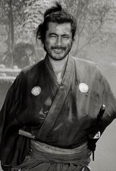 black and white photograph of a man in kimono