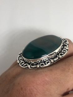 Vintage green agate Ornate German Silver Vintage ring, does not tarnish Size 7 can be re sized, my jeweler charges a $10 - $15 fee All rings are shipped free in the IS in a nice gift box. Check out our over a THOUSAND great reviews Engraving is $4 per letter and is not always perfect depending on the piece. It can take a few days if the jeweler is busy. This is payable to Paypal Judithsltd@gmail.com Green Oval Agate Rings, Green Agate Oval Rings, Vintage Green Nickel-free Rings, Vintage Green Necklace With Oxidized Finish, Green Onyx Rings For Gifts, Green Onyx Rings For Gift, Nickel-free Green Bohemian Rings, Vintage Green Cabochon Jewelry, Vintage Green Turquoise Cabochon Ring