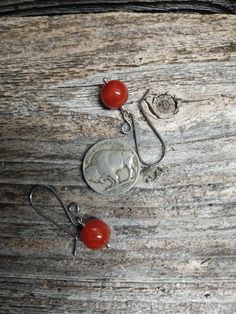 Choose your ear wire to go with these colorful Red Carnelian Bead dangles. The ear wires are available in sterling silver or two types of hypoallergenic wires. In the third picture the ear wires are starting on the left: sterling silver, niobium, titanium and oxidized titanium (I love the color of this last pair!). The red carnelian bead dangles are 10 mm across. They are hand wire wrapped with sterling silver. Made to order and ready to ship in 1-3 days. Carnelian Amber Earrings For Gift, Red Carnelian Pierced Earrings, Adjustable Nickel-free Carnelian Jewelry, Adjustable Nickel Free Carnelian Jewelry, Handmade Adjustable Carnelian Earrings, Amber Carnelian Earrings Gift, Red Round Bead Earrings With Ear Wire, Nickel Free Carnelian Dangle Earrings, Adjustable Carnelian Dangle Earrings