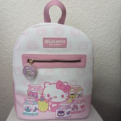 Hello Kitty Strawberry Milk Sanrio Bioworld Mini Backpack With Zipper Pull Nwt, Never Worn, Never Used. Perfect For Your Sanrio Cosplay!! Backpack Is Light Pink With Hello Kitty On The Front With Strawberry Milk. The Front Pocket Has A Purple, Hello Kitty, Metal Zipper Pull. Straps And Bottom Panel Are Pink. Metal Finishing/Zippers Are Gold Tone. Interior Fabric Is Pink. Pictures Are Of The Actual Bag I Will Send. Bag Is Approximately 10" Tall, 5" Wide At Side, 9" Across The Bottom. Make Me An O Kawaii White Backpack For Everyday Use, White Kawaii Backpack For Everyday Use, Cute Everyday White Backpack, Cute White Everyday Backpack, Cute Hello Kitty Print Backpack For Travel, Cute Hello Kitty Travel Backpack, White Cat Design Backpack, White Hello Kitty Kawaii Bag, Cute White Backpack With Adjustable Strap