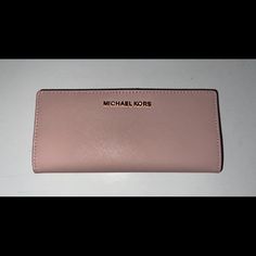 Brand New, Never Used Michael Kors Daily Use Bag, Elegant Everyday Wallets With Logo, Elegant Wallets With Logo, Everyday Michael Kors Bifold Wallet, Michael Kors Clutch Wallet With Card Slots, Michael Kors Wallet With Removable Pouch, Michael Kors Pink Wallet For Daily Use, Michael Kors Pink Wallet, Michael Kors Brown Daily Wallet