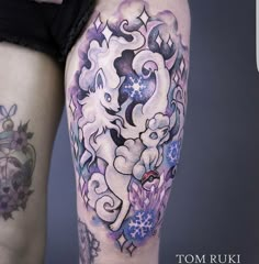 a woman's leg with tattoos on it