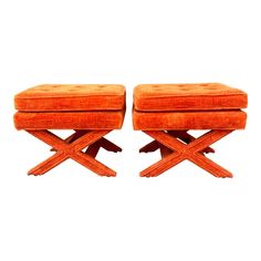 pair of orange velvet stools with x legs