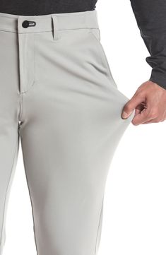 Stay comfy on or off the course in nylon performance pants built with stretch and a roomier fit that slightly tapers off at the ankle. The secure zip pocket helps safely store smaller essentials so you can keep your focus on the game. Zip fly with button closure Front slant pockets; hidden side-zip pocket; back welt pockets 88% nylon, 12% spandex Machine wash, tumble dry Imported Stretch Moisture-wicking Golf Bottoms, Moisture-wicking Stretch Golf Bottoms, Functional Moisture-wicking Bottoms For Golf, Navy Chinos, Grey Chinos, Led Fashion, Khaki Chinos, Leather Label, Golf Pants